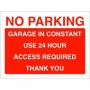 Red and white No Parking Garage In Constant Use 24 Hour Access Required Sign