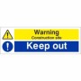 Warning construction site keep out sign with hazard symbol and keep out message