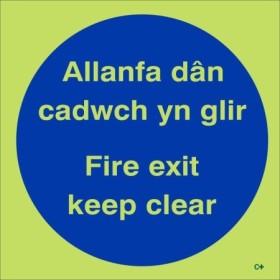 Glow in the dark Fire Exit Keep Clear door sign in Welsh and English
