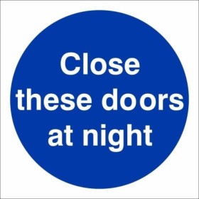 Close These Doors At Night mandatory sign with white text on a blue circular background