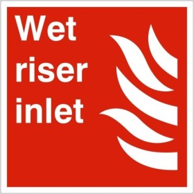Wet Riser Inlet Sign with white text and flame symbol on red background