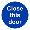 Close This Door mandatory sign with white text on a blue circular background